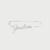 La broche Gaultier argentée