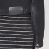 La veste en denim noir à bretelles La veste en denim noir à bretelles