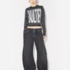 Le jean en denim noir à lanière Le jean en denim noir à lanière