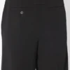 Le pantalon noir à étriers
