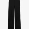 Le pantalon noir à étriers