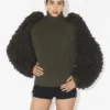 Le pull à mailles bouclées