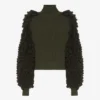 Le pull à mailles bouclées