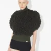 Le pull sans manches à mailles bouclées